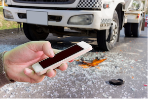 Man with a Cellphone in an Accident