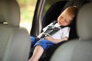 Child sleeping on car seat