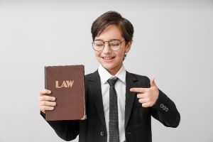 Kid holding a law book