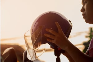 Motorcyclist and helmet