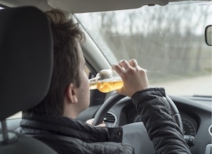 Person driving and drinking