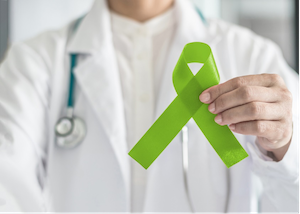 Doctor Holding a Green Ribbon