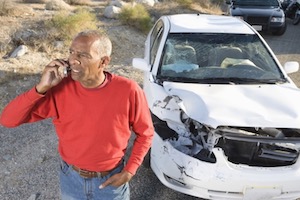 Man calling on cellphone after car crash