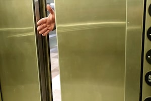 Person stopping elevator
