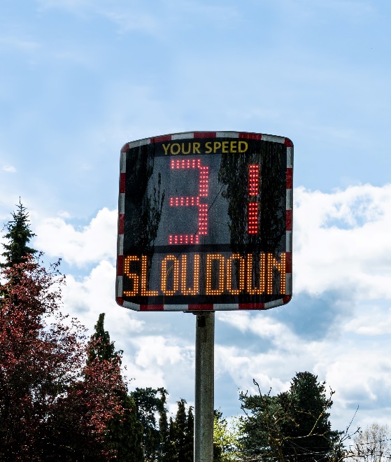 A slow down speed sign