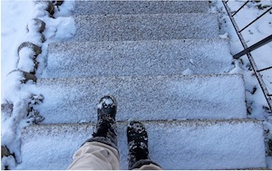 Someone Walking On Snowy Stairs