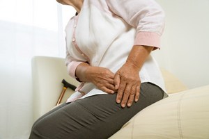 Woman with pain in a hip