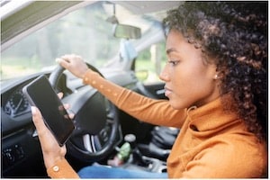 Woman Driving Distracted